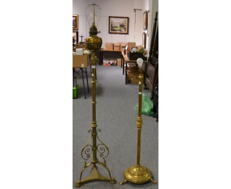 A 19th century brass oil lamp on adjustable standard base converted to a standard lamp; together with another converted brass