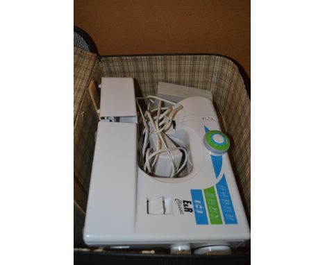 CASE CONTAINING AN E &amp; R CLASSIC SEWING MACHINE