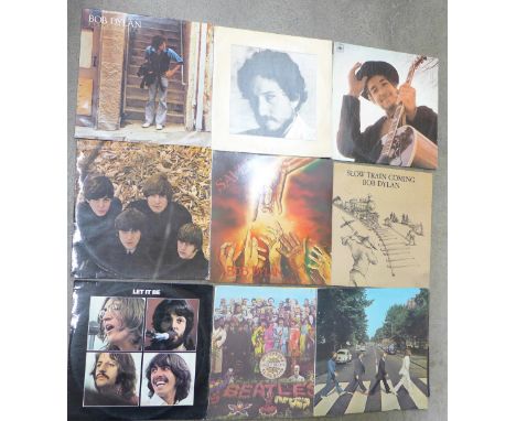 Four The Beatles and five Bob Dylan LP records