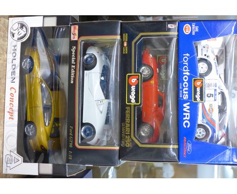 Four 1:18 scale model vehicles; two Burago, one Autostart and Maisto, Ferrari 250 Le Mans, Ford Focus WRC, Holden Concept and