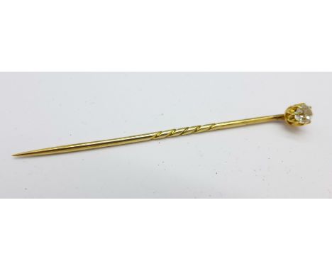 A stick pin with 0.25 carat diamond