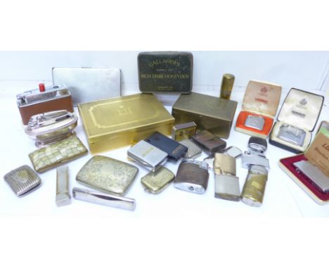 A collection of lighters, cigarette cases, tins, silver plated vestas, including silver plated Ronson, Dunhill, table lighter