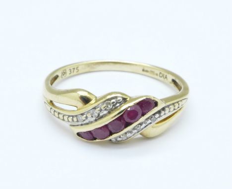 A 9ct gold, ruby and diamond crossover ring