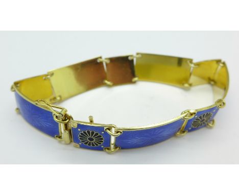 A Norwegian silver gilt and blue enamel bracelet with finely detailed panels, 18cm long, 18g