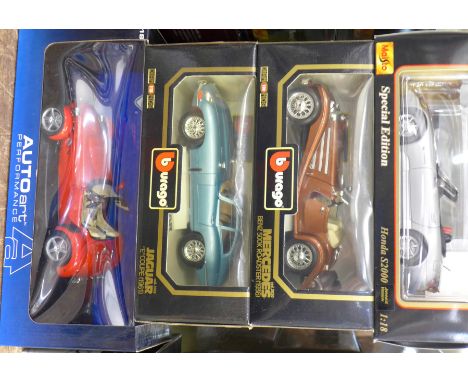 Four 1:18 scale model vehicles; two Burago, one Auto Art and one Maisto, Jaguar E Coupe 1961, Mercedes-Benz 500 Roadster, Pan