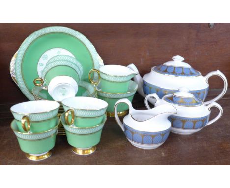 An Adderley fine bone china six setting tea set with cream, sugar and cake plate, a Spode Marble Arch teapot and sugar basin 