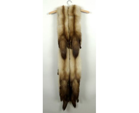 A vintage Jekmoth garment carrier, in cream floral patterned linen with green interior, together with two vintage fox fur sto