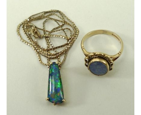 An Edwardian 9ct gold and opal ring, the oval stone within a rope twist and loop setting, size N, 3g, together with a 9ct gol