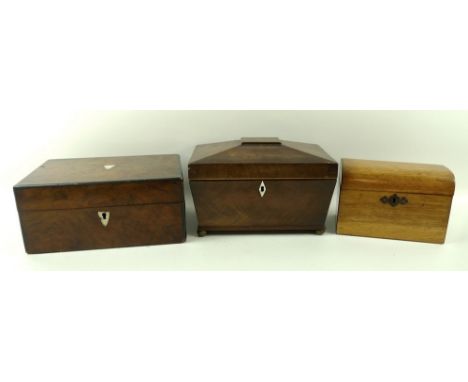 A Regency mahogany tea caddy, 24 by 15 by 16cm, a Victorian oak tea caddy, 17 by 10 by 12cm, and a burr walnut sewing box, 25