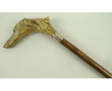 A walking stick with moulded greyhound head, with silver collar, London, circa 1925, 90cm. 