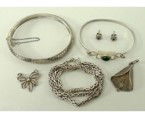 A group of jewellery comprising a Russian green stone cabochon set silver bangle, and a silver chain necklace, pair of ear st