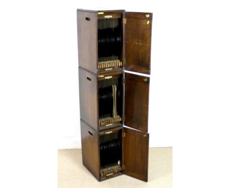 Three vintage 'The Mellophone' stackable record cabinets, each oak veneered cabinet fitted with numbered pull out sectional s