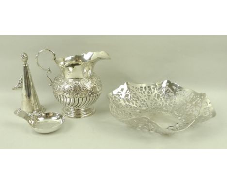 A jug with floral repousse and gadrooned decoration, 9cm, a caddy spoon, a candle snuffer, and a mid 19th century Irish silve