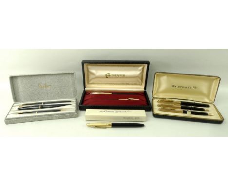 A collection of vintage pen sets, comprising a Parker Victory fountain pen with 14K nib, Duofold ball point pen, and propelli