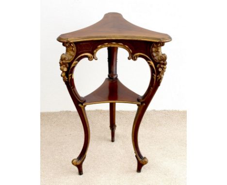 A French 19th century mahogany occasional table, the concave triangular surface with rounded corners and step moulded edge, s