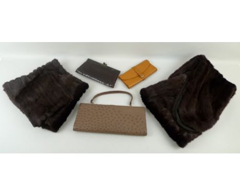 A collection of vintage textiles, comprising two fur coats, two fur stoles, and three clutch bags. (7)