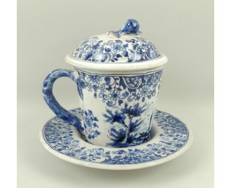 A Delftware cup and cover with saucer, Meissen Helene Wolfsohn, circa 1860, mark to base, in coblat blue on a thick white lea