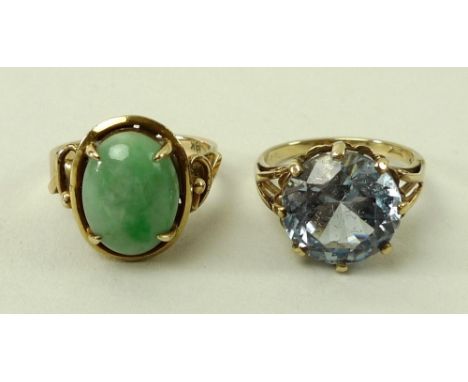 An 18ct gold and jade ring, the decorative claw mount set with oval apple green jade, size L, 5.2g total weight, and a 9ct go