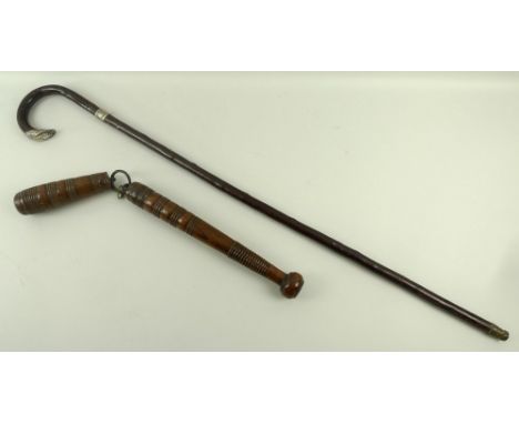 A silver topped and collared cane, Birmingham 1900, 93cm, and a vintage truncheon with chain linked bludgeon/grappler, 52cm. 