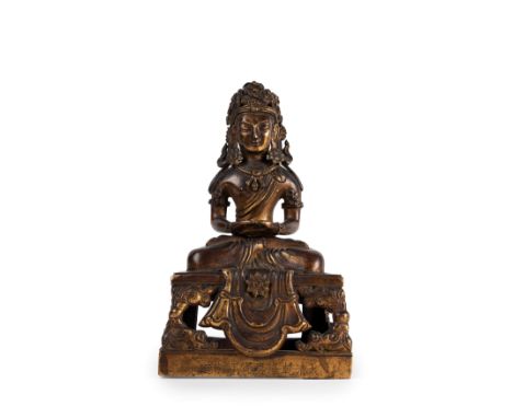 Gilt bronze figure of the Buddha Amitayus seated on a pedestal. It bears the six-character mark of the Qianlong Emperor and t