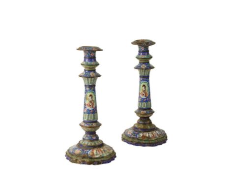 PAIR OF CHINESE ENAMEL CANDLESTICKS, Qing, circa 1820, decorated in polychrome with panels of elegant women, on a blue ground