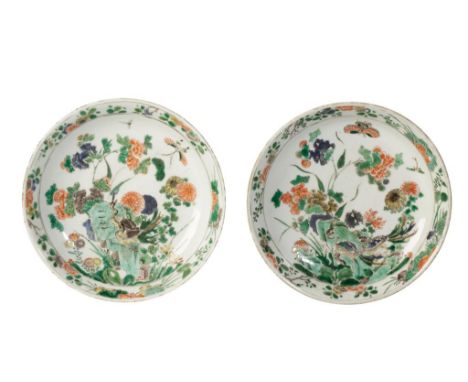 PAIR OF FAMILLE VERTE DISHES, KANGXI PERIOD, painted with peacocks and insects within a blossoming rocky outcrop, each bears 