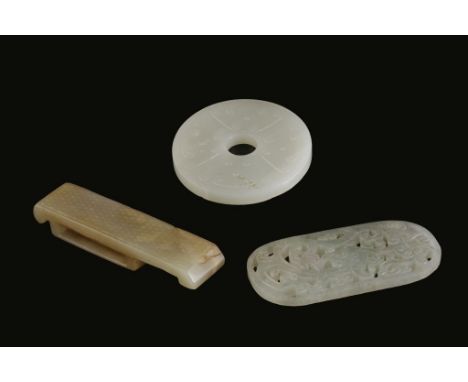 CARVED WHITE JADE DISC, in the archaic style, 5.5cm diam; together with a RUSSET JADE SWORD SCABBARD, in the archaic style, 8