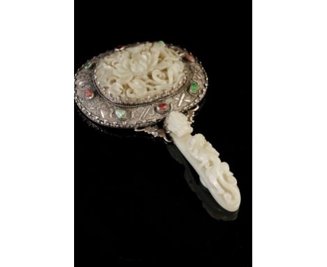 FINE WHITE JADE AND SILVER MOUNTED HAND MIRROR, QING DYNASTY, 18TH / 19TH CENTURY, the jade plaque finely carved in relief wi