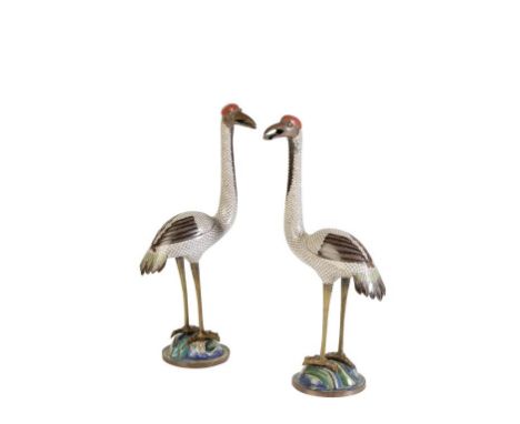 PAIR OF CLOISONNE CRANES, QING DYNASTY, 19TH CENTURY, each naturalistically modelled standing on a cloisonné enamel base, the
