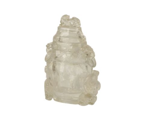 LARGE CARVED ROCK CRYSTAL VASE AND COVER, the baluster sides carved in low relief with bats and clouds, the base flanked by t