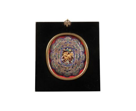SILVER AND ENAMEL HAT ORNAMENT, QING DYNASTY, 19TH CENTURY, centred by a gilt Qilin within an ornate filigree work surround d