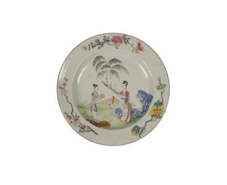 FAMILLE ROSE ENAMEL CHARGER, QING DYNASTY, 18TH CENTURY, painted with painted with courtiers within a fenced garden, the rim 