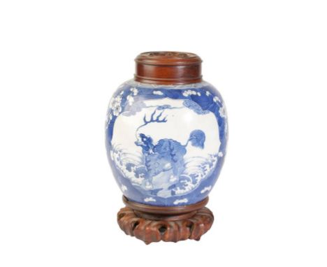 BLUE AND WHITE 'QILIN' GINGER JAR, KANGXI SIX CHARACTER MARK BUT 19TH CENTURY, with a wood base and cover, the ovoid sides pa