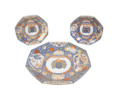 LARGE IMARI EXPORT OCTAGONAL DISH, KANGXI PERIOD, the centre painted with a Corbeau family crest, reserved against a rich bor