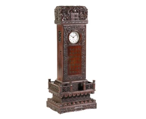 IMPRESSIVE CARVED HONGMU WATCH CASE, QING DYNASTY, 19TH CENTURY, of tall case form, the door carved with a band of scrolling 