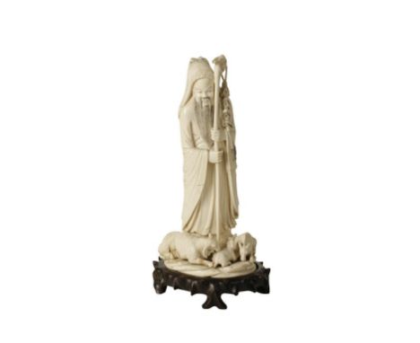 LARGE CARVED IVORY FIGURE, LATE 19TH / EARLY 20TH CENTURY, modelled as a shepherd wearing a long cloak and holding a staff wi