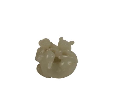 SMALL WHITE JADE CARVING OF TWO CATS, QING DYNASTY, 19TH CENTURY, finely carved with the two felines coiled around a flowerin