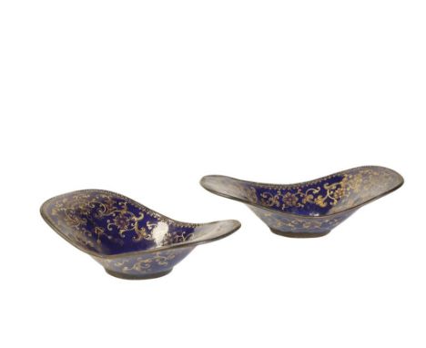 PAIR OF BLUE-GROUND CANTON ENAMEL CUP STANDS, QING DYNASTY, 18TH CENTURY, of boat shape form, decorated in gilt with stylised