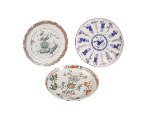 TWO FAMILLE VERTE DISHES, KANGXI PERIOD, one painted with a flowering vase, the other flowering stems, 22cm &amp; 21cm diam; 