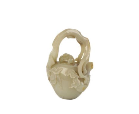 CELADON JADE 'PEACH' FORM TEAPOT, the jade with russet inclusions, of naturalistic form, the cover surmounted by a monkey and