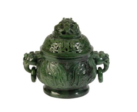 SPINACH JADE ARCHAIC STYLE CENSER, the compressed ovoid sides carved with taotie masks, with twin dragon mask and loop handle