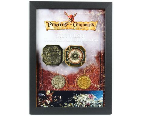 Pirates of the Caribbean: The Curse of the Black Pearl (2003) - two 'Spanish doubloon' coins and a replica compass, in a fram