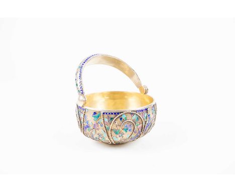 A small Russian silver and cloisonné enamel swing-handle basket, impressed marks to rim, 10 cm diameter x 12 cm high, 270g.Co