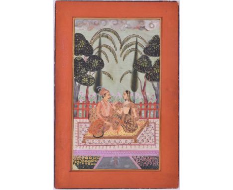 Indian School, 19th/20th century, a noble man and female companion, seated upon a low bed within a garden, 26.5 x 17.7cmCondi