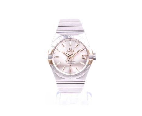 An Omega Constellation Co-Axial chronometer wristwatch, with silvered dial, gilt baton markers, centred seconds and date aper