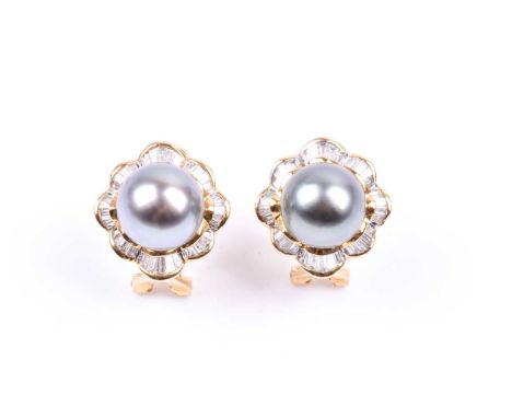 A pair of yellow gold, diamond, and Tahitian South Sea black pearl earrings, each with a pearl surrounded with a skirted bord