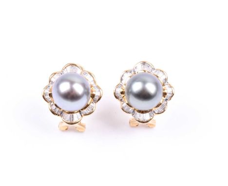 A pair of yellow gold, diamond, and Tahitian South Sea black pearl earrings, each with a pearl surrounded with a skirted bord