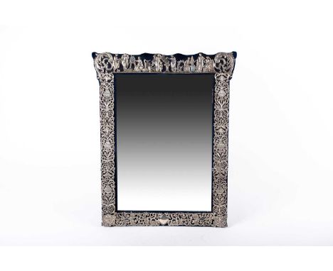 A late Victorian silver easel mirror, London 1891 possibly John Brasier for Henry Wilkinson &amp; Co; the shaped rectangular 