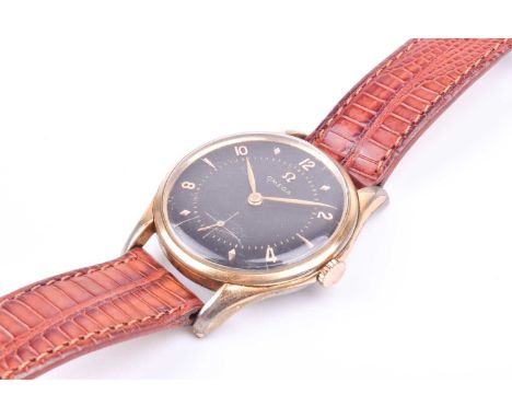 A1960s Omega gold plated mechanical wristwatch, the black engine turned dial with applied numerals, arrow and diamond indices