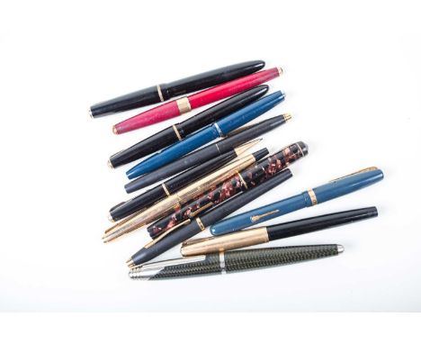 A collection of vintage pens and pencils, to include a Conway Stewart fountain pen in marble effect case, a Waterman fountain